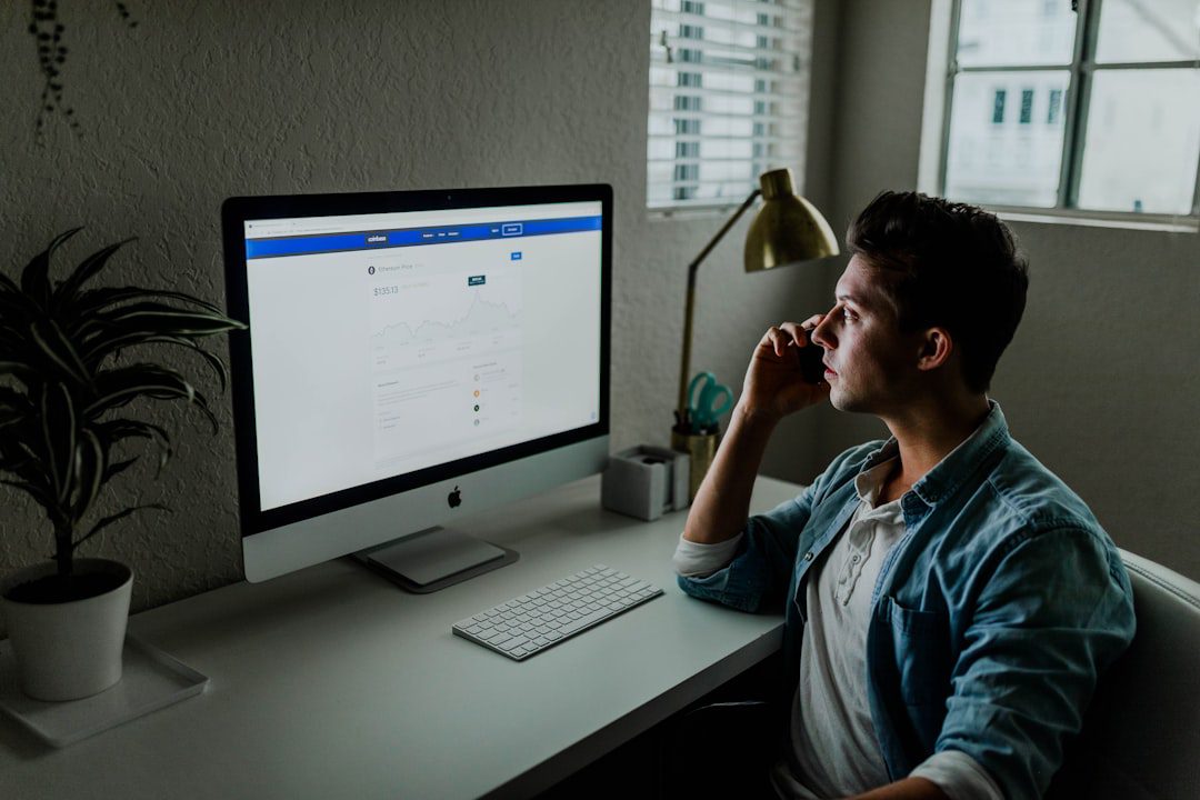 chiro at computer looking at facebook ads